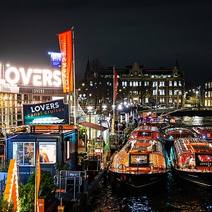 Amsterdam light festival 2025 2026 lovers canal cruises boats at dock with lights and art