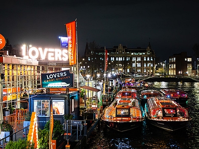 Amsterdam light festival 2025 2026 lovers canal cruises boats at dock with lights and art
