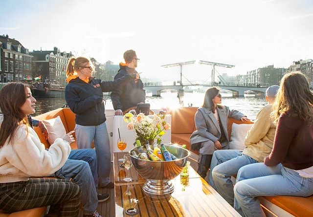 Lovely cruises people on boat enjoying views amstel