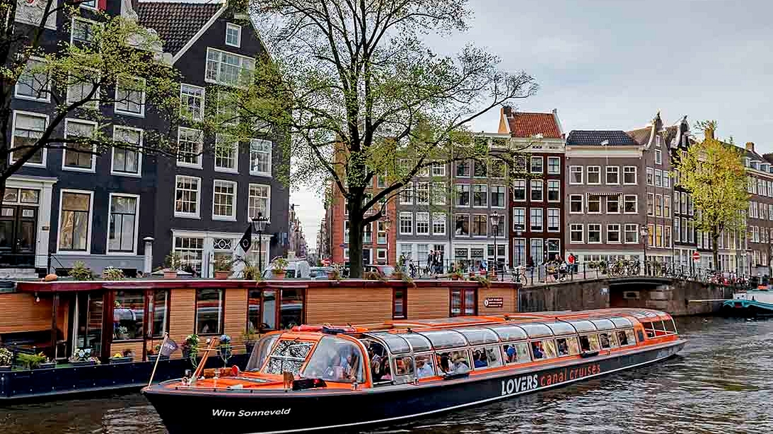 Canal cruise past house boat