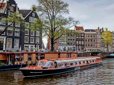 Canal cruise past house boat