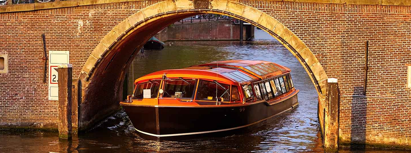 LOVERS Canal Cruises boat on the canals in autumn