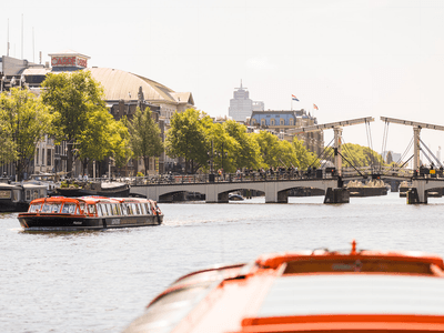 Lovers boats in front of the Skinny Bridge Amsterdam preview 1386x1042