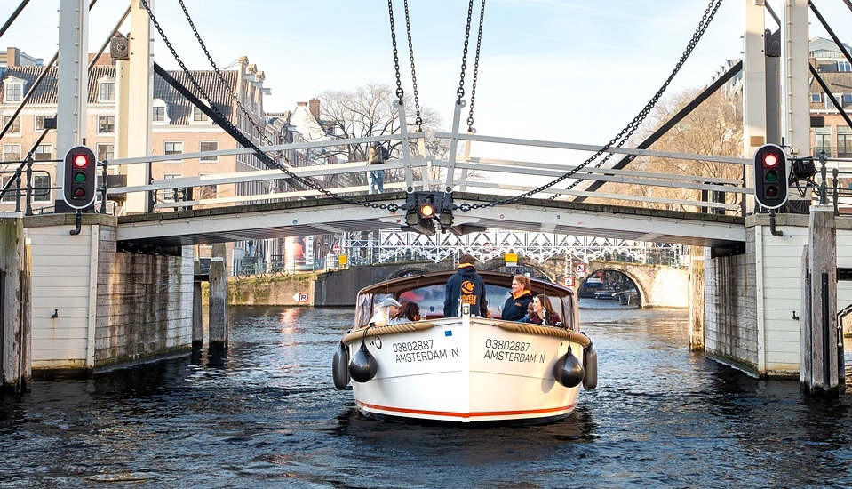 Lovely cruises amsterdam preview with boat under bridge