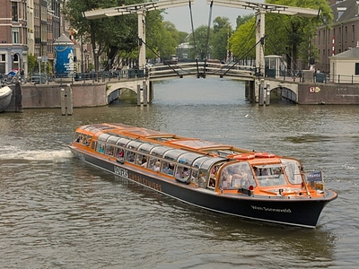 Lovers canal cruise at wooden bridge amsterdam boat