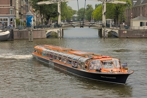 Lovers canal cruise at wooden bridge amsterdam boat