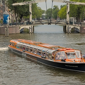 Lovers canal cruise at wooden bridge amsterdam boat