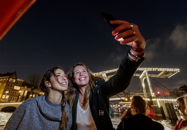 Lovers evening cruise preview girls taking selfie on water